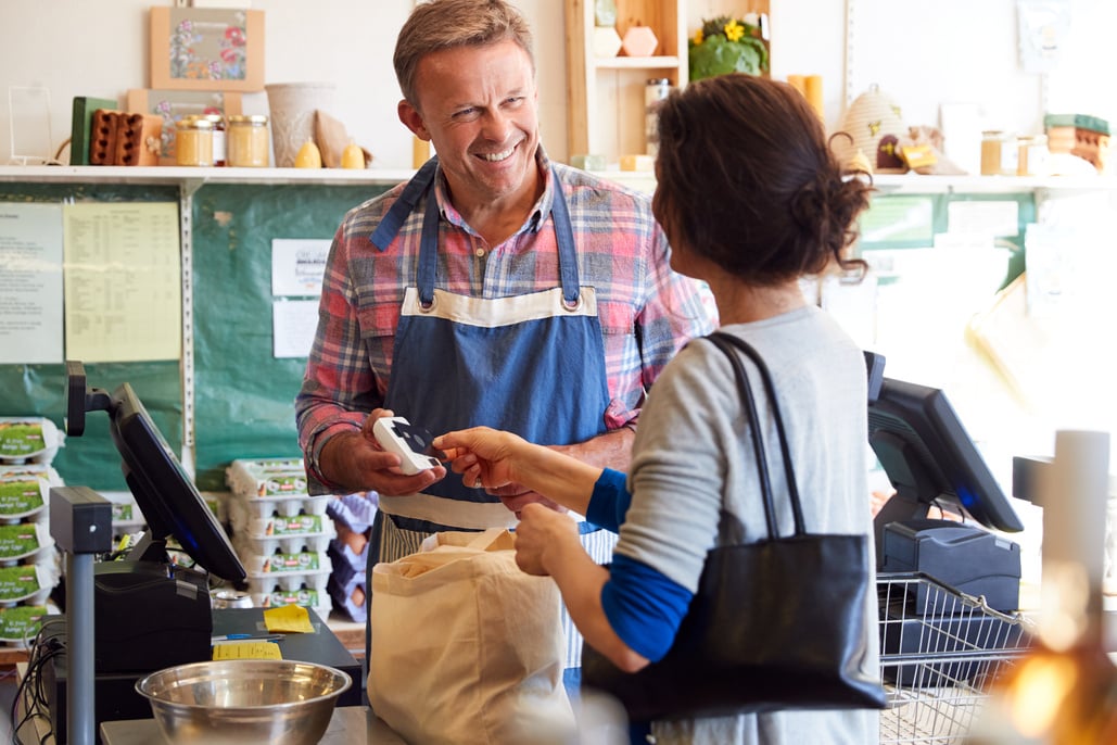 Customer at Checkout of Organic Farm Shop Making Contactless Pay