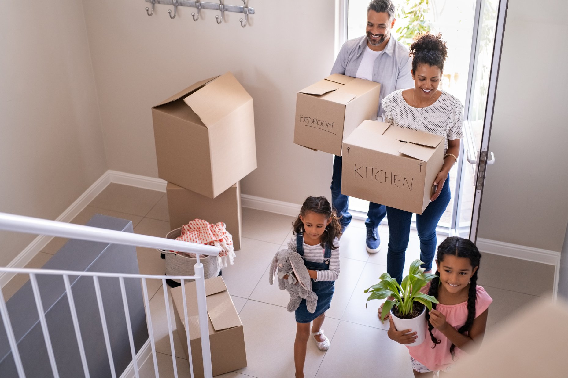 Multiethnic family moving in new home